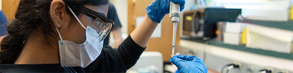 Female student in science lab.